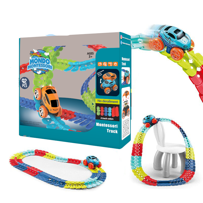Happy kids playing with a vibrant flexible race track, racing toy cars & building unique Montessori track designs.