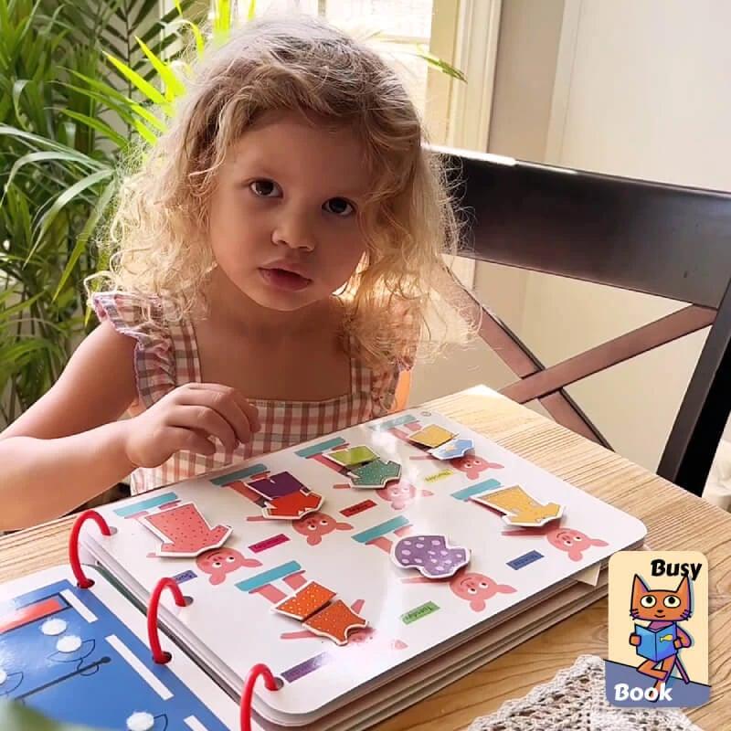 Vibrant baby sensory book, a fun educational toy for early learning, fine motor skills, & exploration.