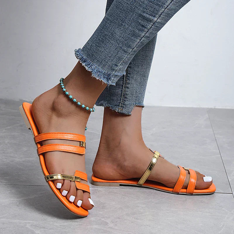 Stylish flat beach footwear for women, ideal open toe vacation slippers.