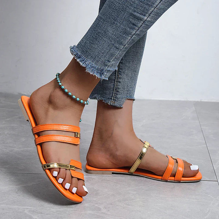 Stylish flat beach footwear for women, ideal open toe vacation slippers.