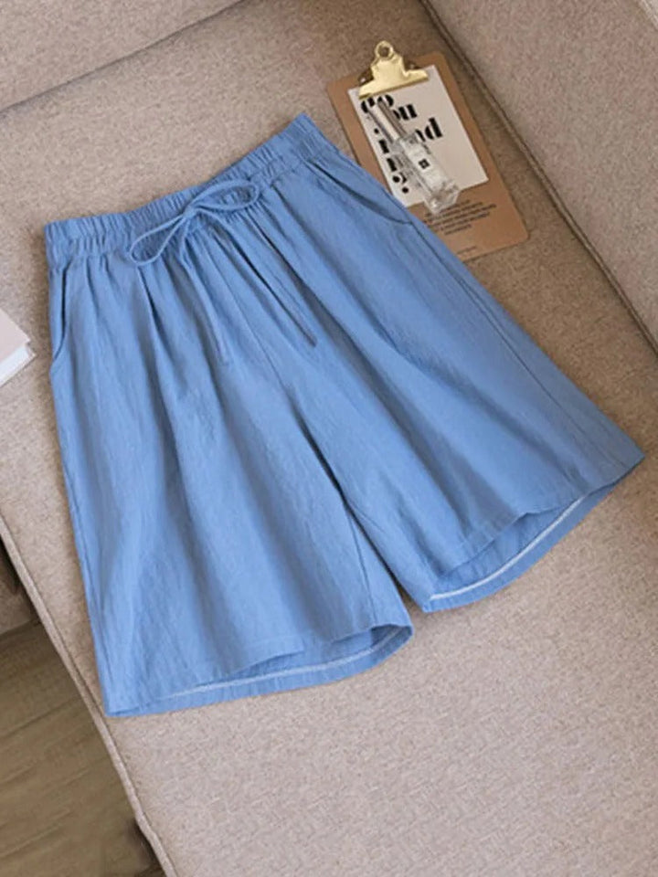 Stylish Melina women's stretch shorts, featuring a comfortable elastic waist. Ideal breathable bottoms for summer.