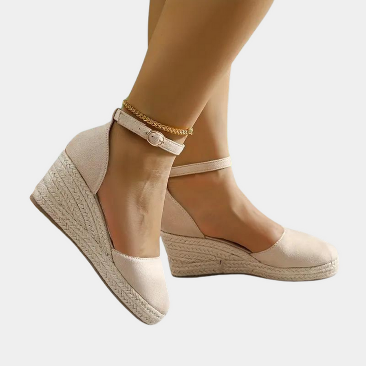 Comfortable women's wedge heels with an adjustable ankle strap, ideal for all-day wear and casual style.