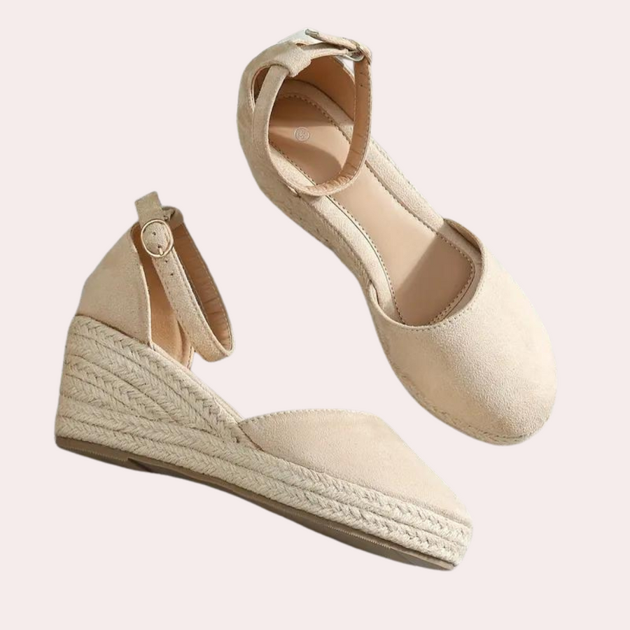 Elegant women's wedge sandals with an adjustable strap, perfect summer footwear for casual or office wear.