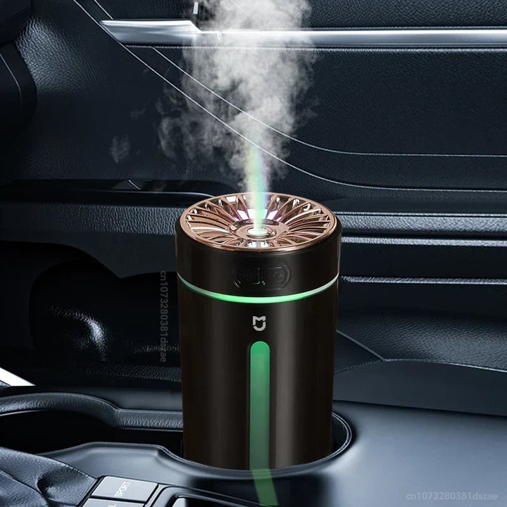 Portable AeroMist USB humidifier powered by laptop, delivering quiet, continuous mist for air comfort.