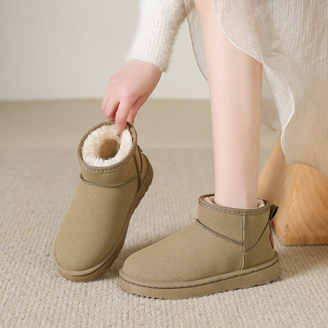 Stylish low-cut women's ankle winter boots, warmly lined for comfort and a chic winter outfit.