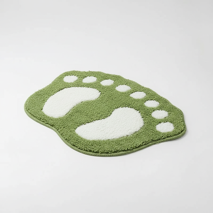 Stylish CozyFoot foot-shaped bath rug absorbing water, perfect for shower and tub use, home decor