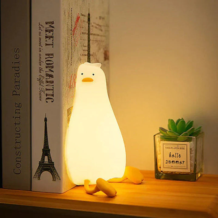 Silicone duck LED night light, QuackLite, for kids' rooms, a gentle bedside lamp for peaceful sleep.