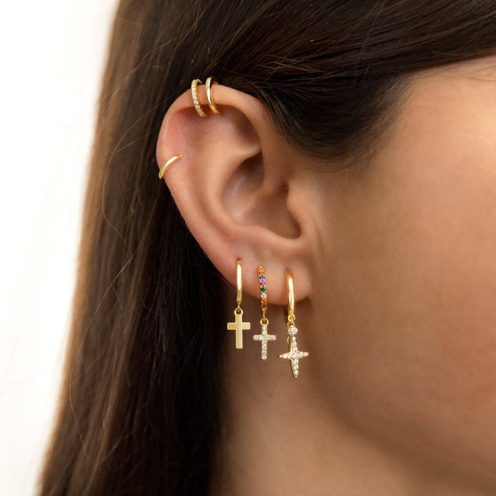 Elegant sterling silver hoop earrings with gold plated cross pendant, women's dainty religious jewelry.
