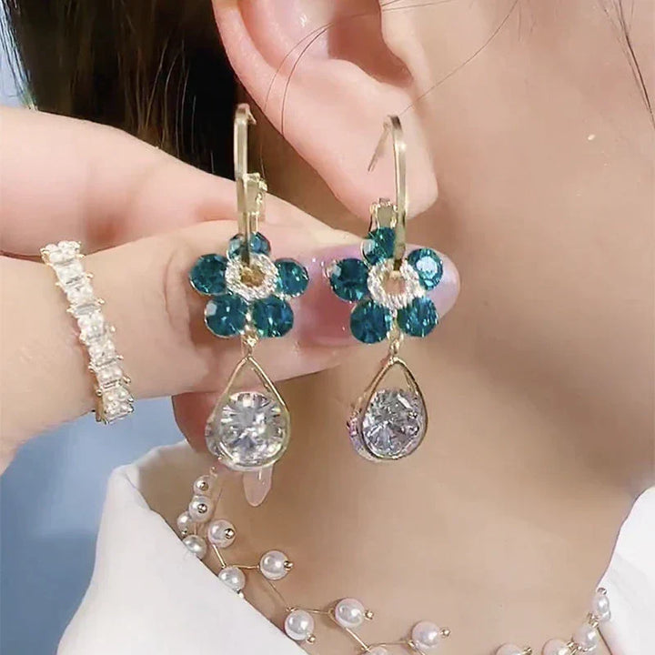 Dainty women's crystal flower stud earrings, perfect for elegant everyday wear or special occasions.