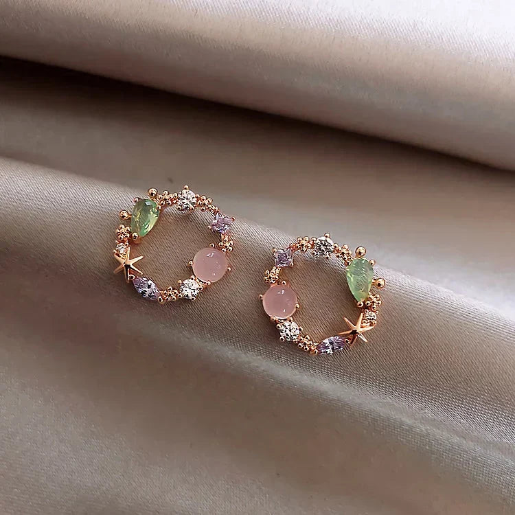 Dazzling women's gold flower earrings with sparkling zirconia stones, an elegant floral jewelry gift for her.