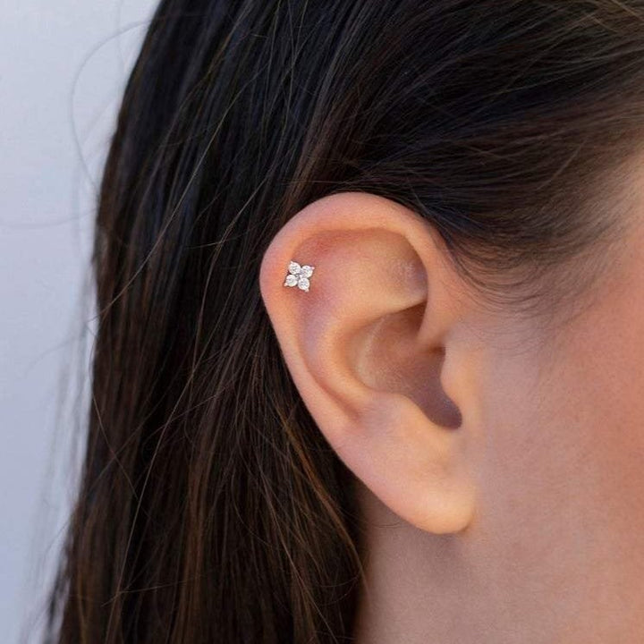 Delicate gold flower stud earrings with CZ pave for women, hypoallergenic and elegant everyday jewelry.