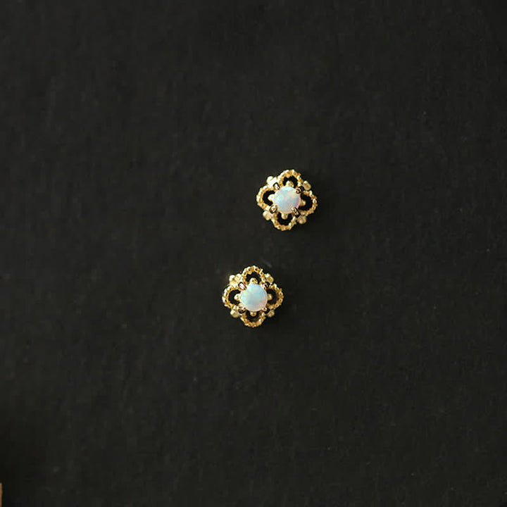 Pair of delicate vintage opal drop earrings for women, elegant and timeless.