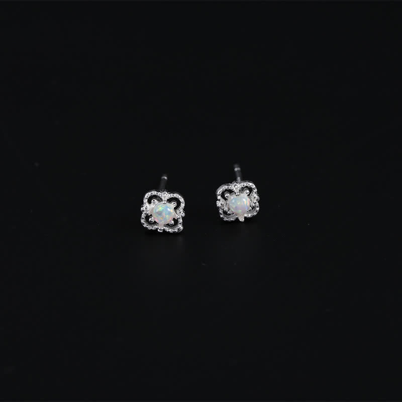 Women's vintage opal drop earrings with a delicate, refined design.