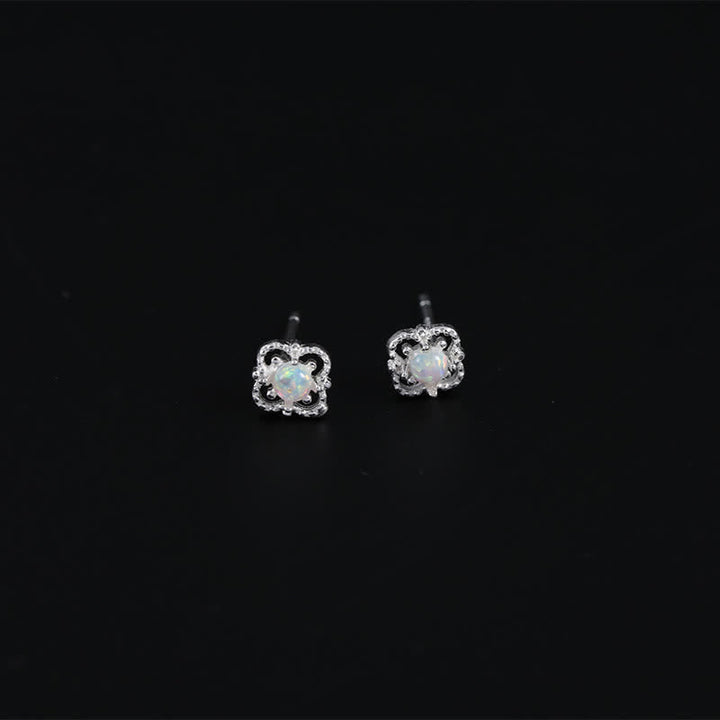 Women's vintage opal drop earrings with a delicate, refined design.