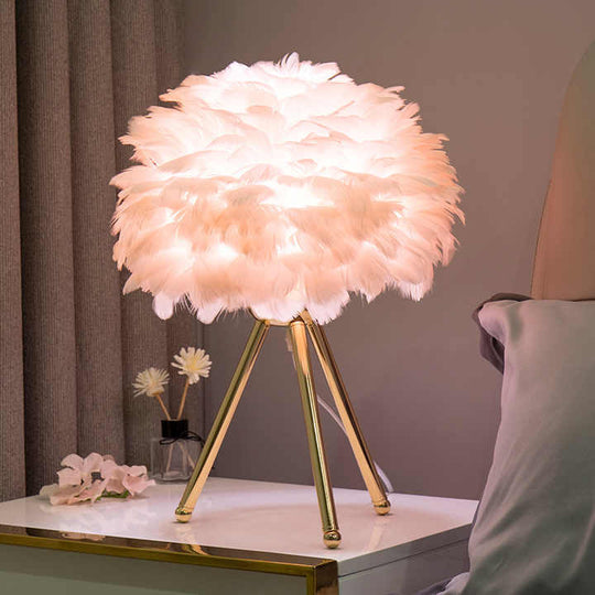 Chic dimmable feather lamp for elegant home decor, perfect as a luxury bedroom or living room lighting fixture.