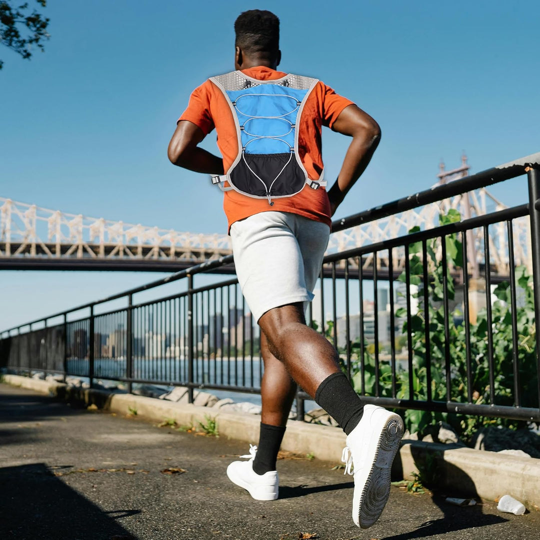 Man hiking with the Dravien Ultra-Light Hydration Vest, demonstrating its versatility outdoors