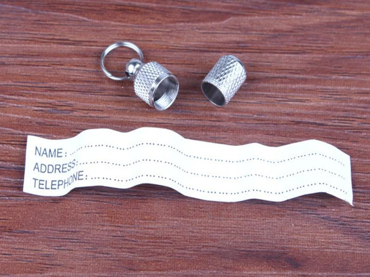 SafePaw™ metal pet ID tag for cats & dogs. Ensures pet safety with clear identification & address.