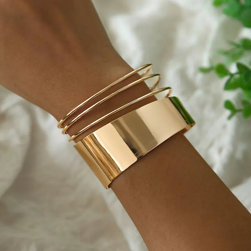 Edgy punk cuff bracelet crafted from shiny stainless steel, ideal for a rebellious unisex style statement.