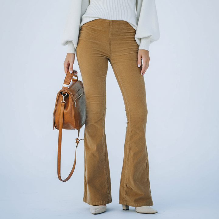 Full length shot of black Annemarie flared pants, showcasing elastic waist and bell bottom design.