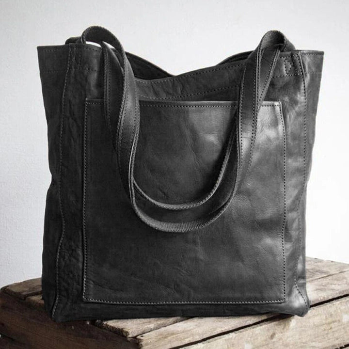 Chic dark brown leather shoulder bag for women. A durable and elegant fashion accessory, ideal for daily use.
