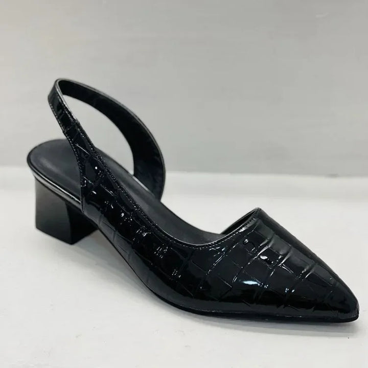 Texture close-up of the smooth material on women's elegant slingback block heel pumps by Annika