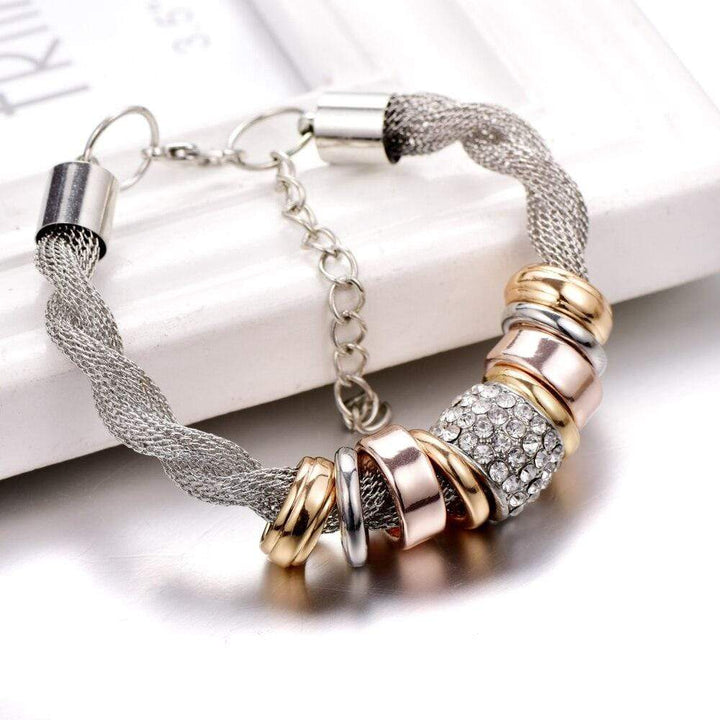 Chic gold braided women's fashion bracelet, an elegant everyday accessory, Zarina branded.