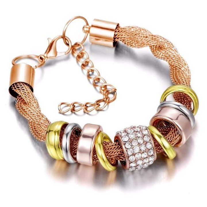 Detailed view of women's braided gold fashion bracelet, reflecting quality and stylish jewelry.