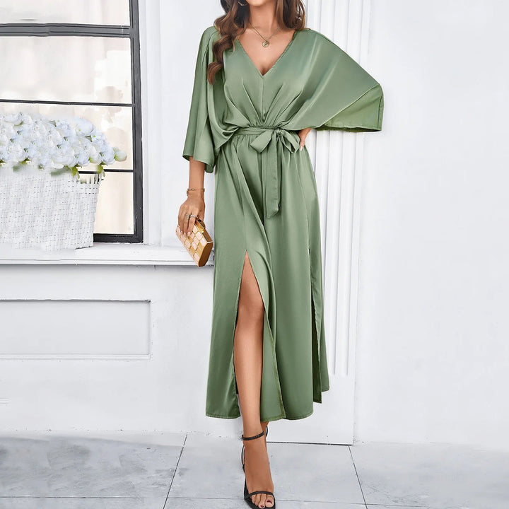 Women's vibrant green V-neck flowy spring dress, versatile for casual chic or a party outfit.
