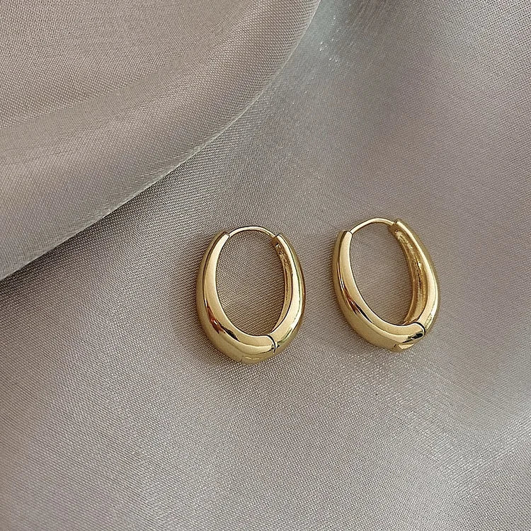 Elegant classic gold hoop earrings for women. Hypoallergenic plated jewelry, a timeless fashion accessory and gift.