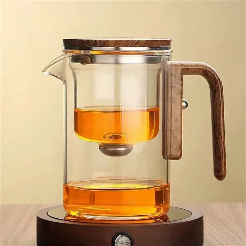 Elegant clear glass teapot with removable stainless steel infuser for loose leaf or herbal tea.