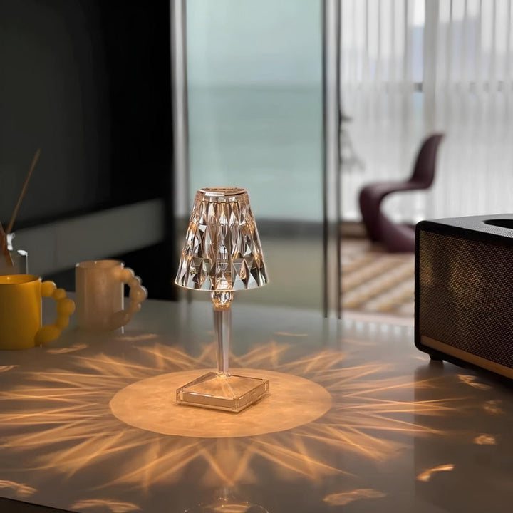 Unisex crystal table lamp with touch control, casting beautiful shadows, LED powered.