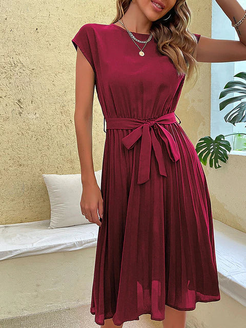 Close-up of elegant pleats on a stylish Felina women's mini dress, highlighting comfortable fabric texture.