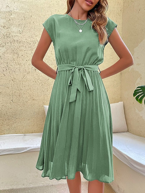 Back view of a chic Felina women's short sleeve pleated mini dress, versatile for spring and summer outings.