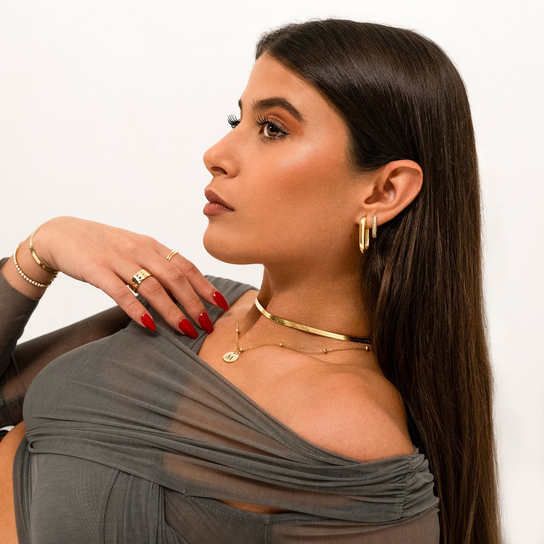 Helena gold flat chain necklace, a stylish and elegant women's jewelry piece.