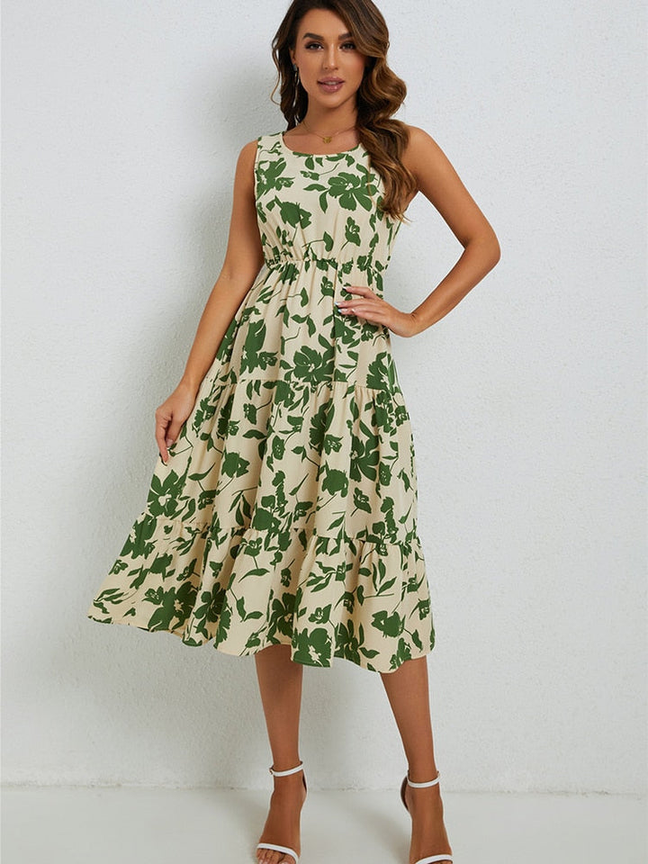 Flowy sleeveless midi dress for women, featuring a vibrant floral print, ideal for comfortable summer days.