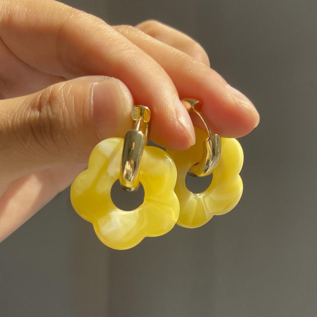 'Valeria' gold flower earrings, adding a touch of colorful elegance to any outfit.
