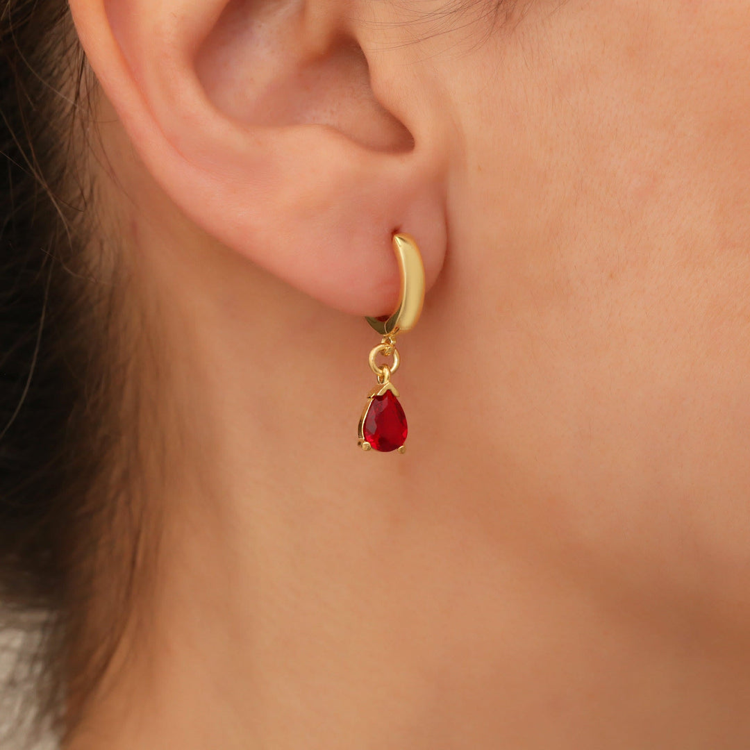 Women's gold plated necklace & teardrop earrings with vibrant red garnet, a January birthstone.