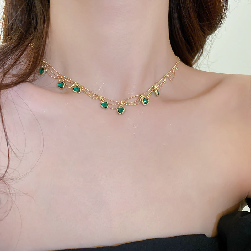 Elegant gold tone heart necklace, a stunning women's jewelry piece. Ideal romantic gift, features an adjustable chain.