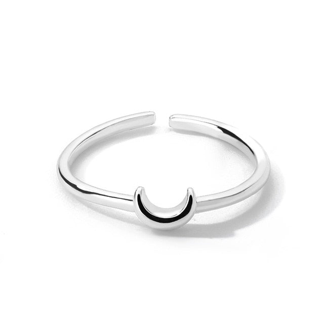 Delicate crescent ring for women, a minimalist & versatile adjustable jewelry piece. Gold/silver tones.