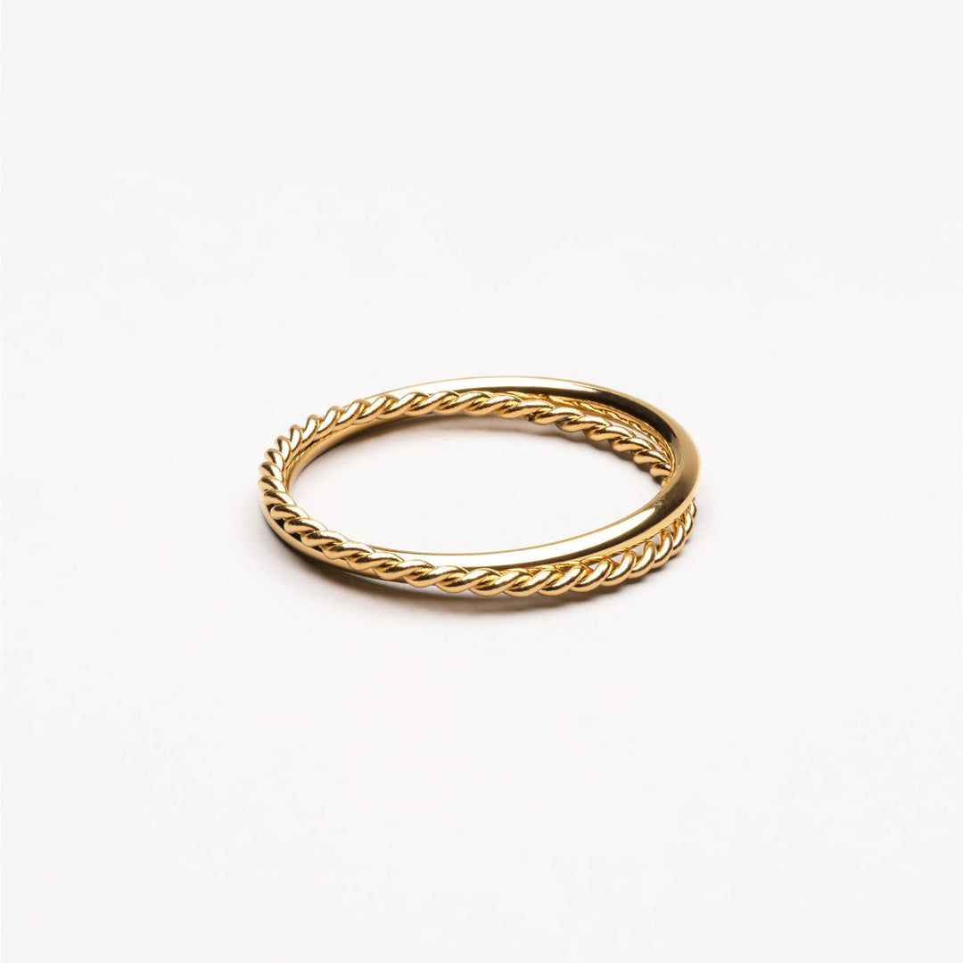 Elegant gold women's Harmony double band ring, a stylish fashion accessory.