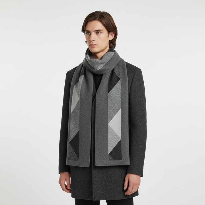 Unrolled men's cashmere scarf on a wooden surface, highlighting its exceptional softness and elegant appeal.