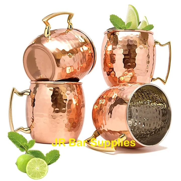 Shiny hammered copper mugs for cold drinks. Stylish drinkware, perfect gift idea or home decor.