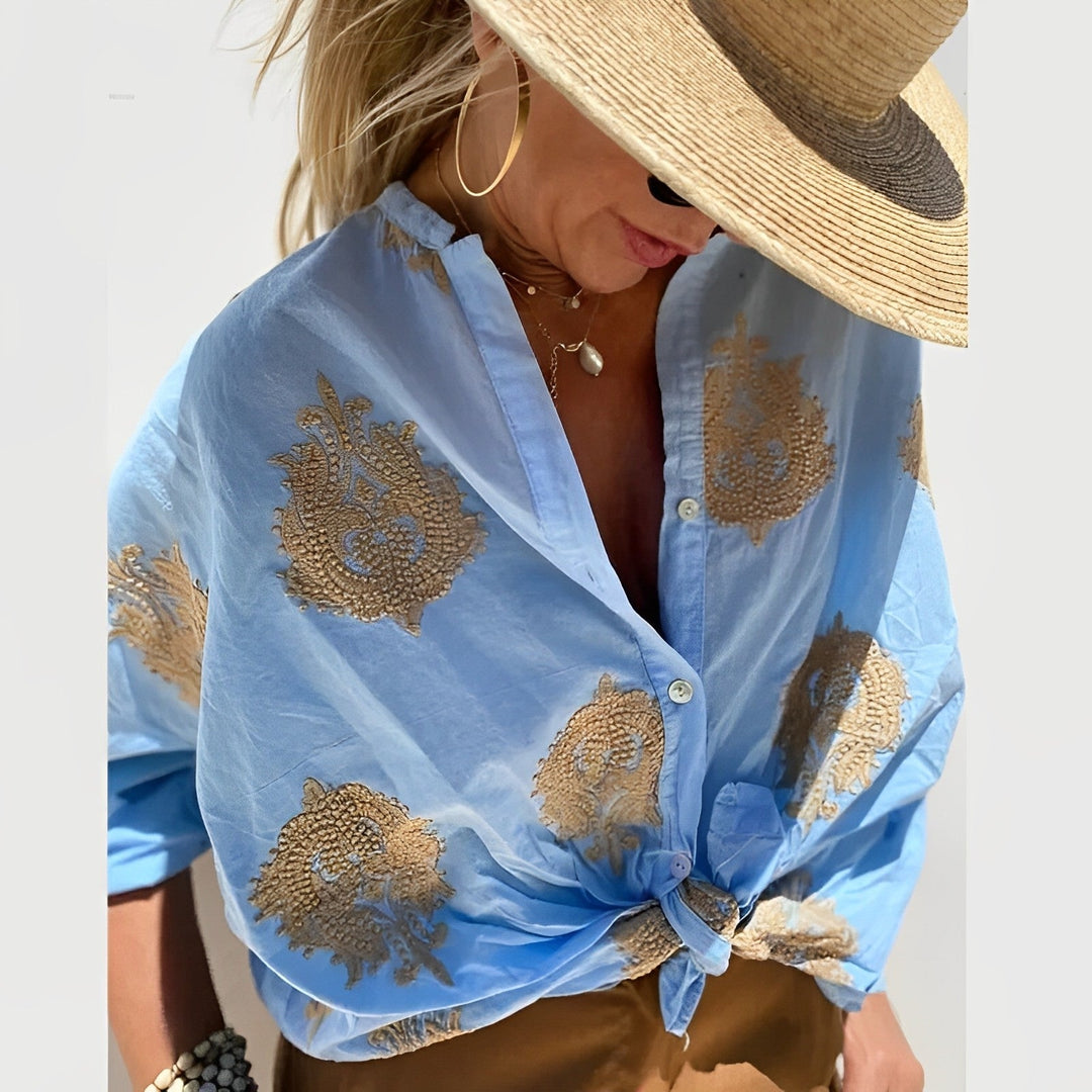 Elegant Isabelle women's tailored blouse in a light color, perfect for chic fashion and versatile wear.