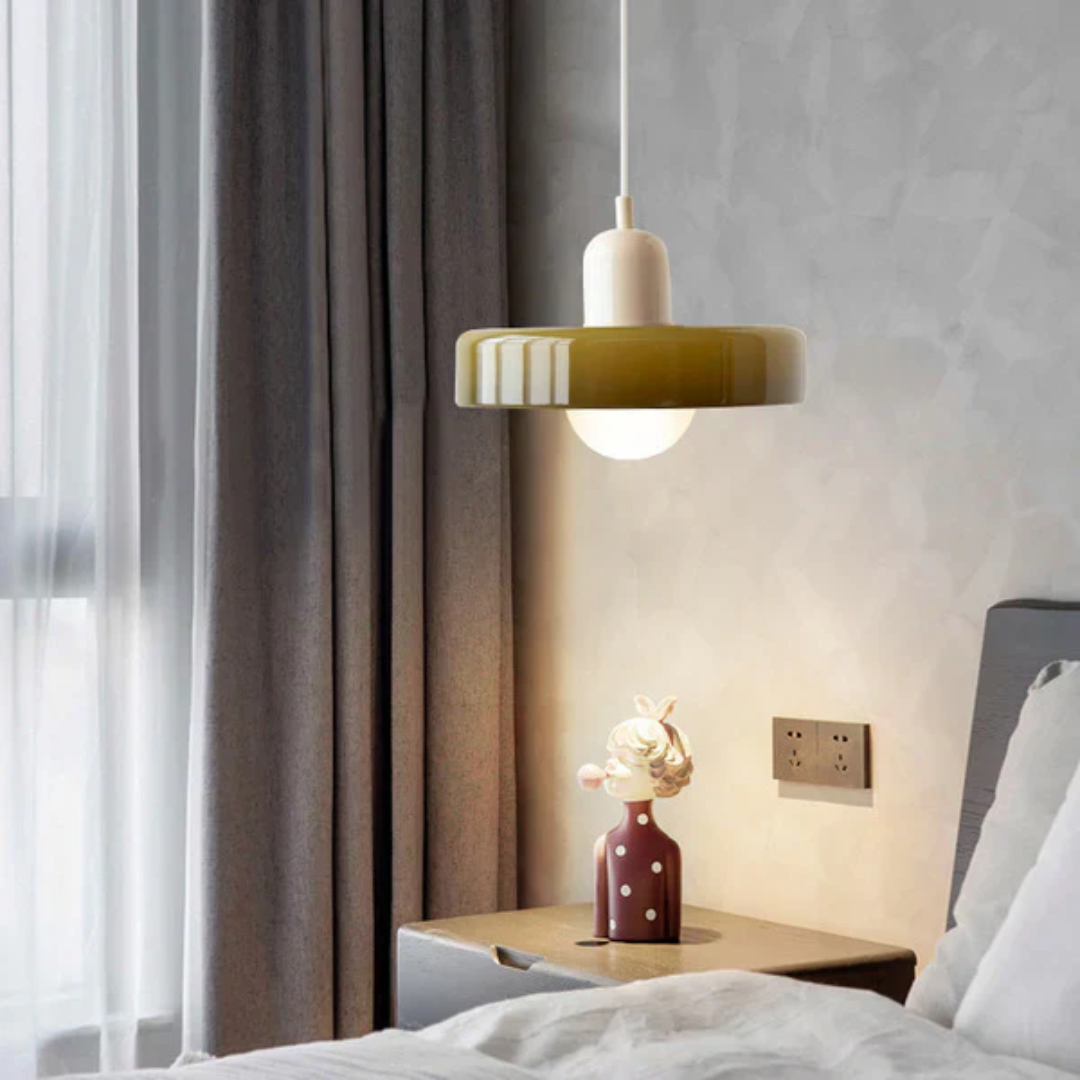 Energy efficient LED pendant lamp, clear glass globe, ideal for dining room ambiance.