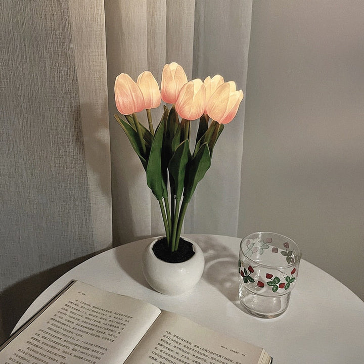 Bedroom scene with an elegant LED tulip night light, providing warm and inviting floral decor.