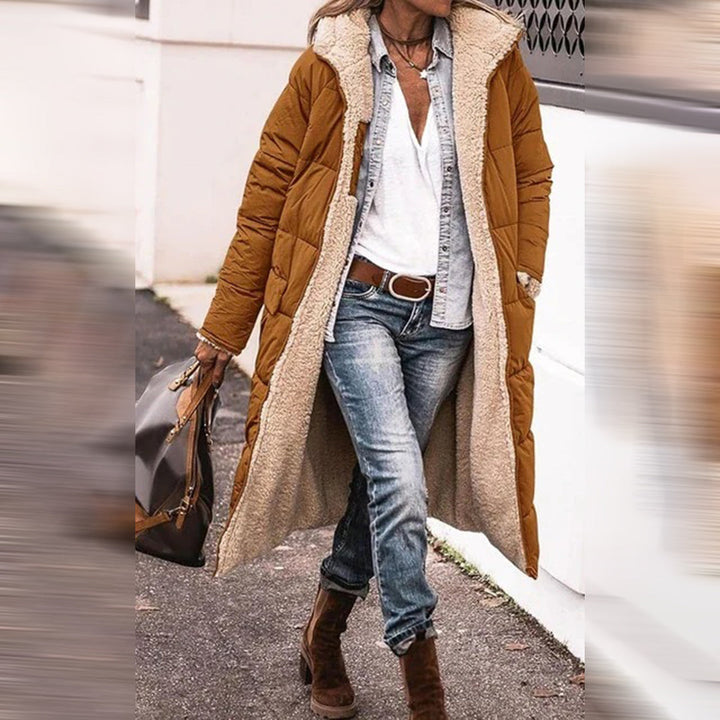 Warm long women's winter coat, Nova, offering elegant protection for cold weather. Stylish outdoor outerwear fashion.