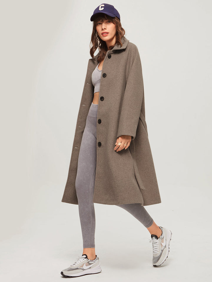 Elegant long women's winter coat, offering cozy warmth & chic style. Perfect fashion outerwear for cold weather.