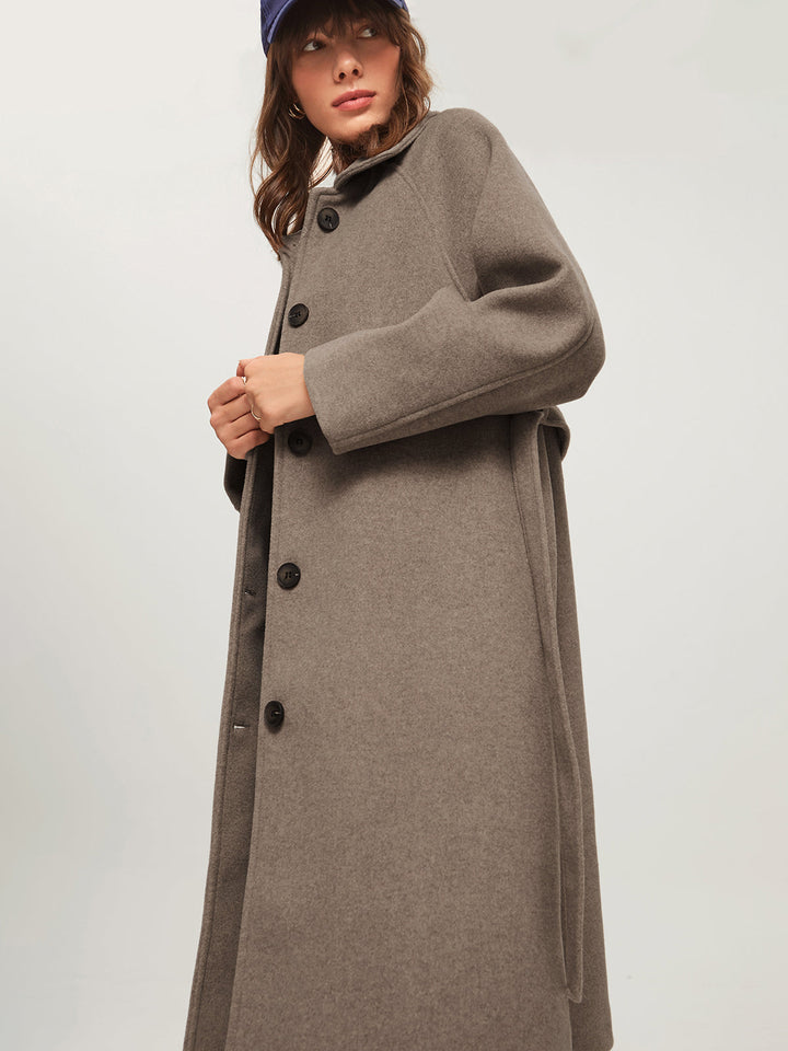 Warm long women's coat, ideal for winter. Cozy & elegant fashion outerwear, a must-have in ladies' cold-weather collection.