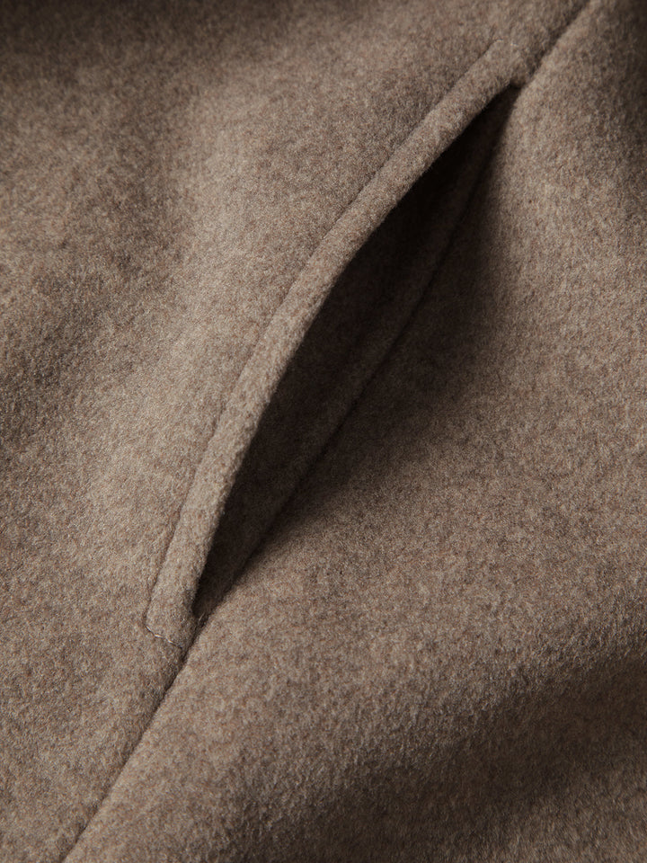 Chic long women's winter coat, providing ultimate warmth & a sophisticated look. Essential ladies fashion outerwear.