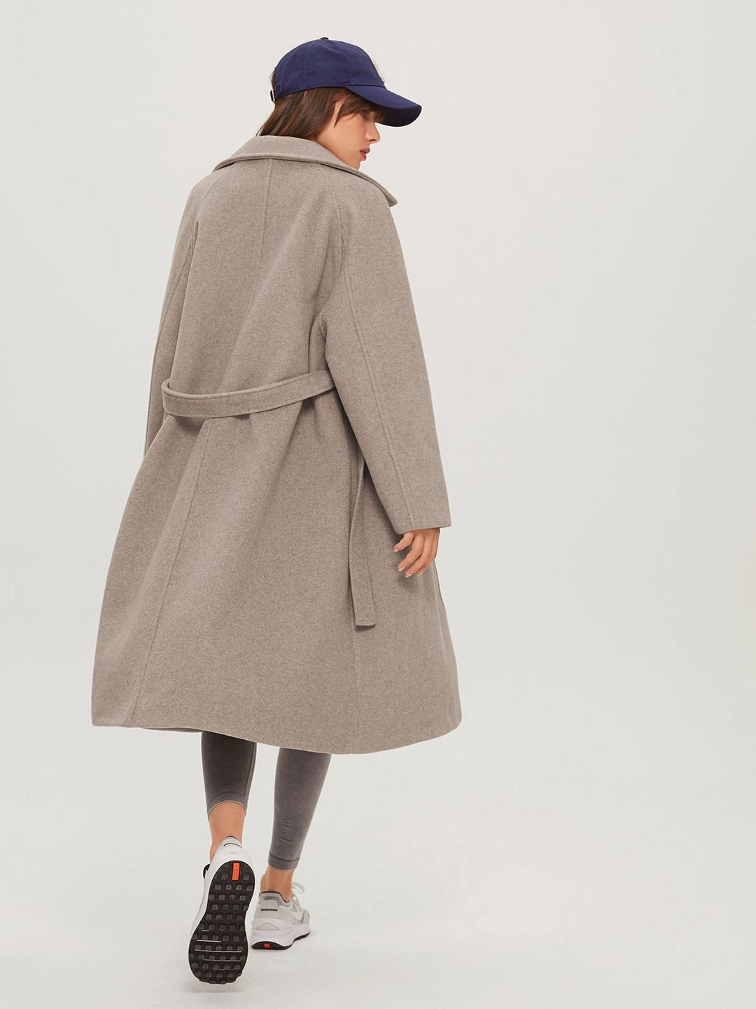 Oversized long women's winter coat, combining cozy comfort with stylish design. Warm ladies fashion outerwear for winter.